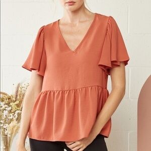 Boutique entro terra cotta peplum top